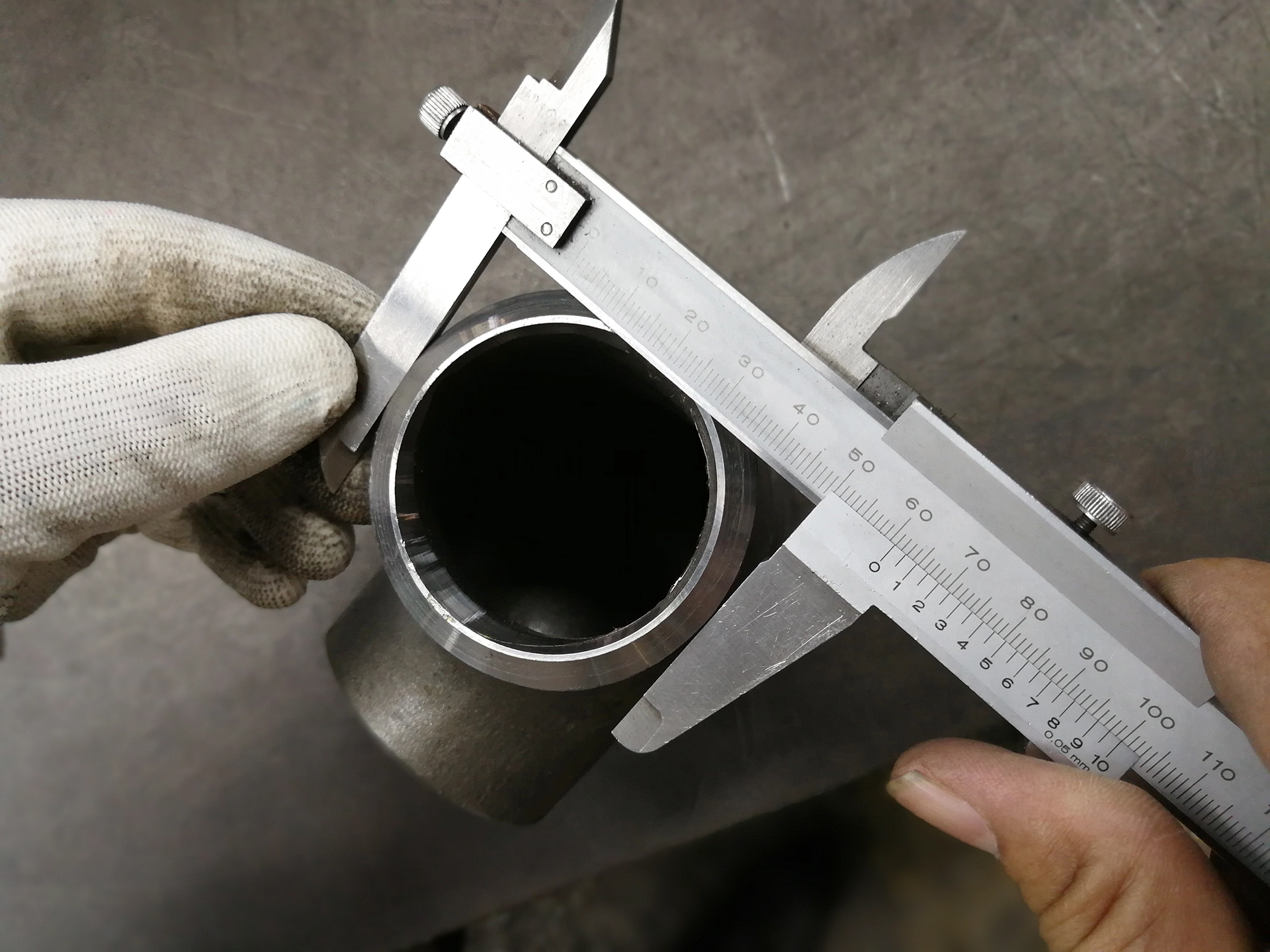 Dimensional inspection of an alloy steel pipe fitting