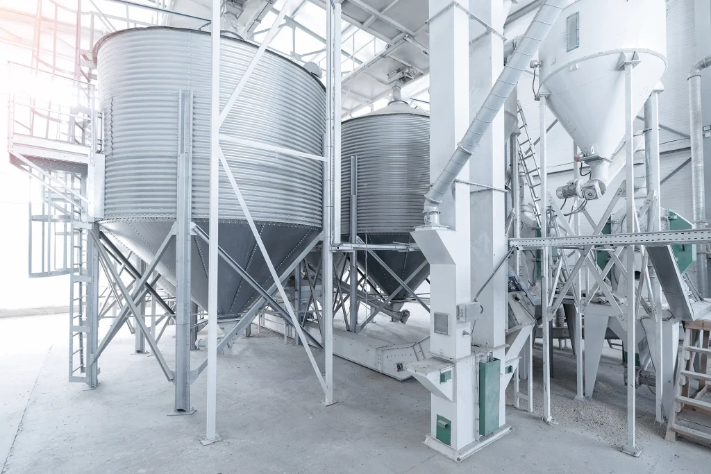 Industrial grain processing facility with storage silos and equipment