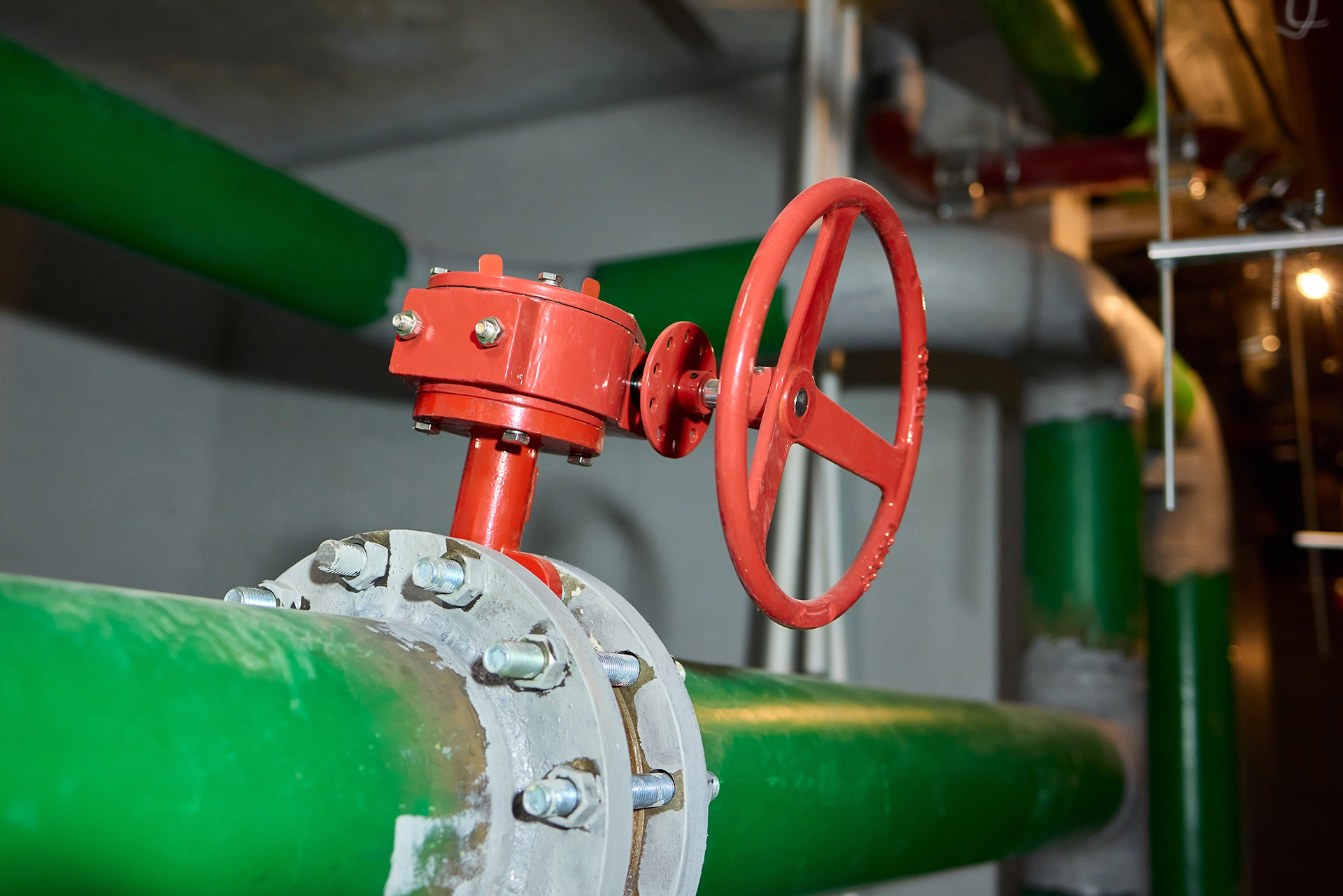 Industrial valves and piping arranged throughout a process system