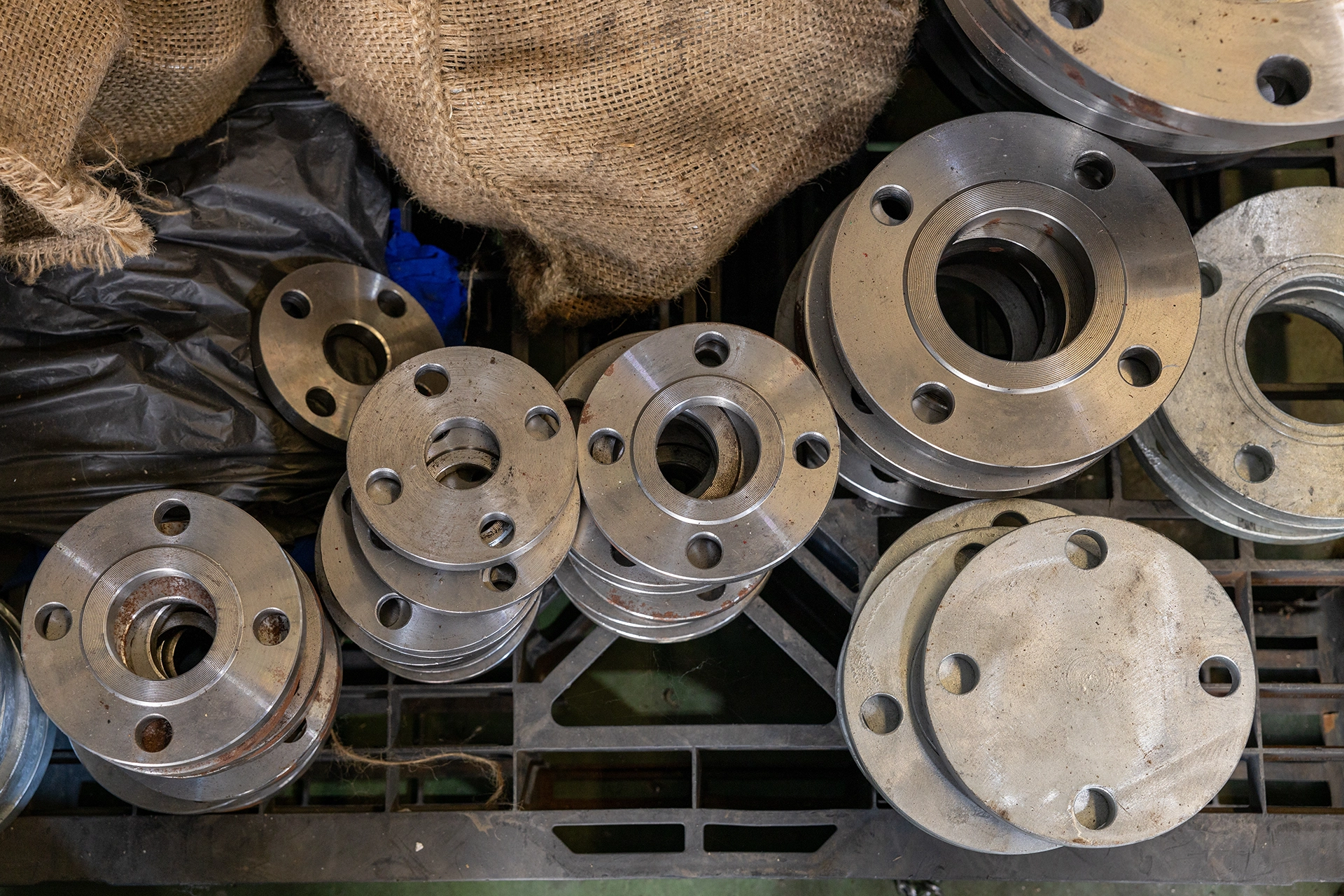 Stacked metal flanges for industrial piping connections
