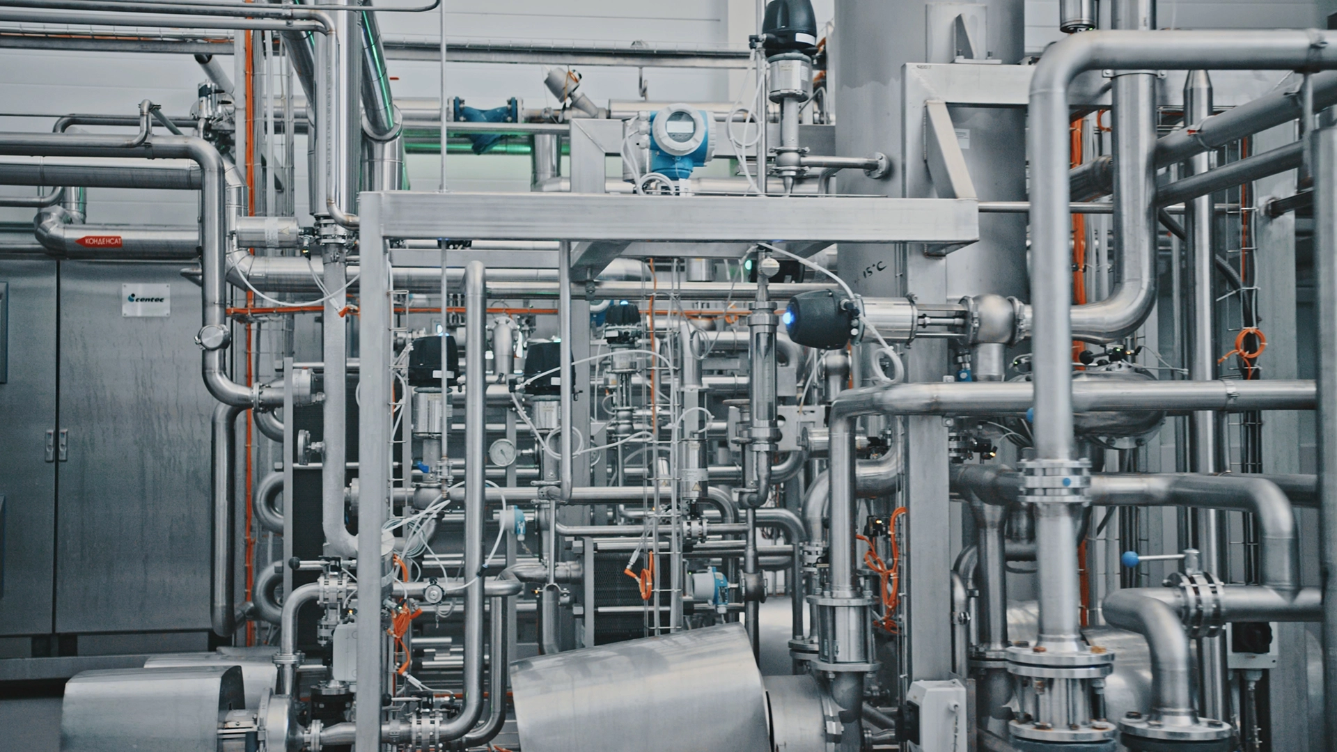 Stainless steel industrial piping system with valves and process equipment