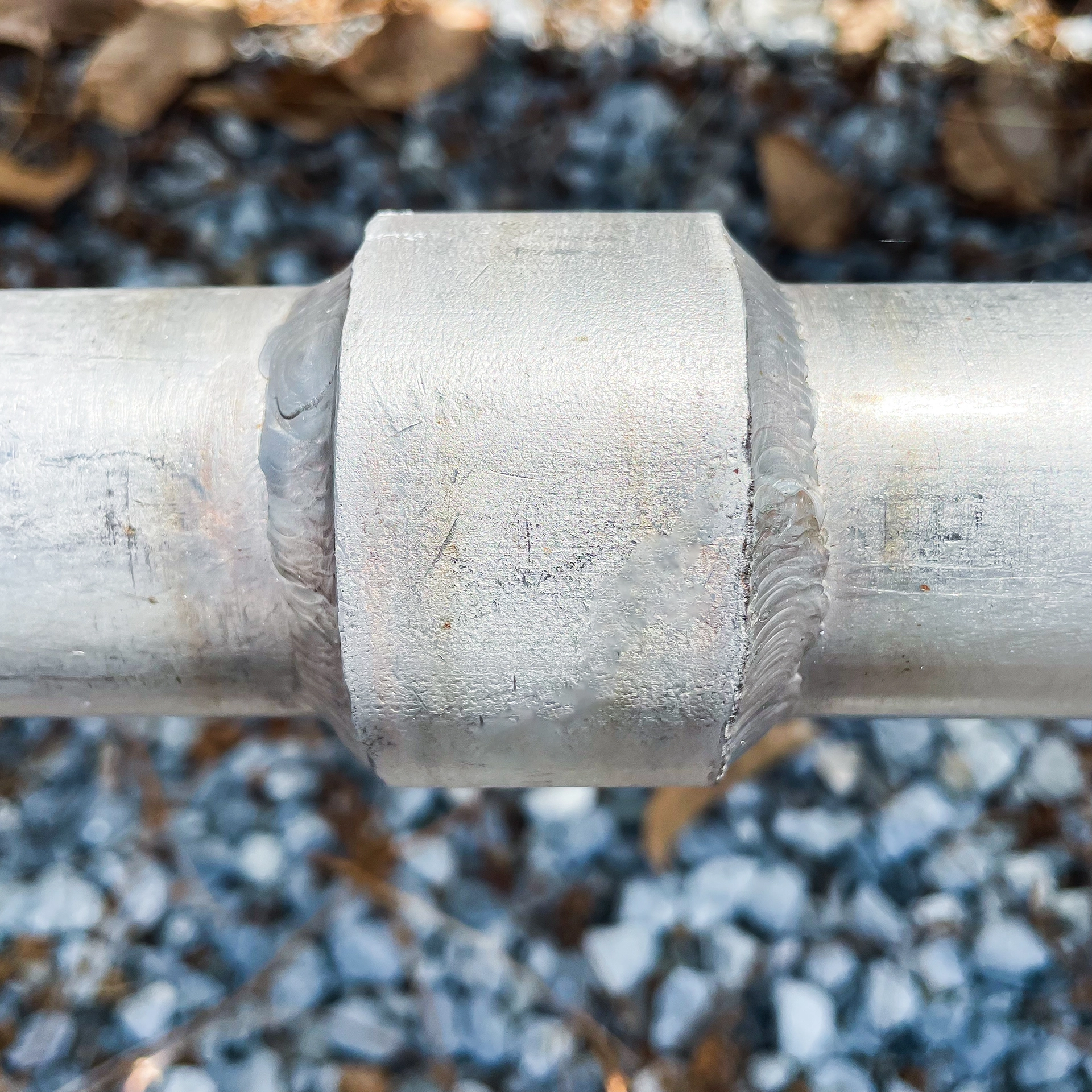 Close-up of a stainless steel pipe welded joint